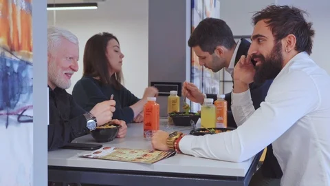 Man talking on the speakerphone while at the lunch 스톡 동영상 102216597