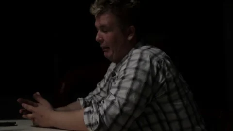 Man talking at the table and ape close-up Stock Footage 71575605