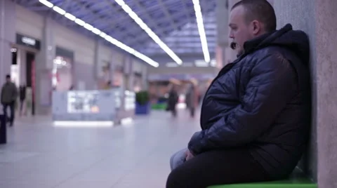 The man talking with a teenager sitting on bench Stock Footage 59790067