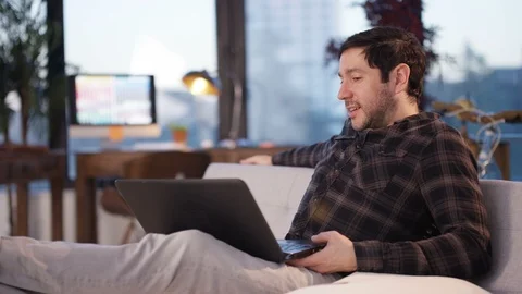 Man talking on a video call on laptop in office Stock Footage 107638550