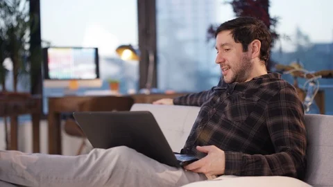 Man talking on a video call on laptop in office Stock Footage 107639225