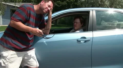 Man Talks to Lady in Car Stock Footage 12598869