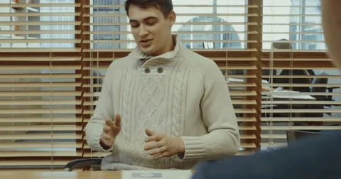 A man talks in the office Stock Footage 64171491