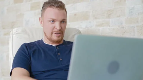 The man talks on Skype on the laptop Stock Footage 62519171
