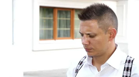 Man talks on telephone Stock Footage 10732597