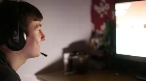 Man Talks Through Headset on Online Video Game Video stock 45842705