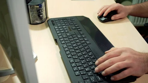 The man tapes the keyboard Stock-Footage 85579580