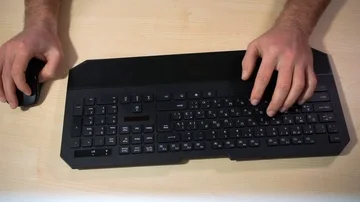 The man tapes the keyboard Stock Footage 85579600