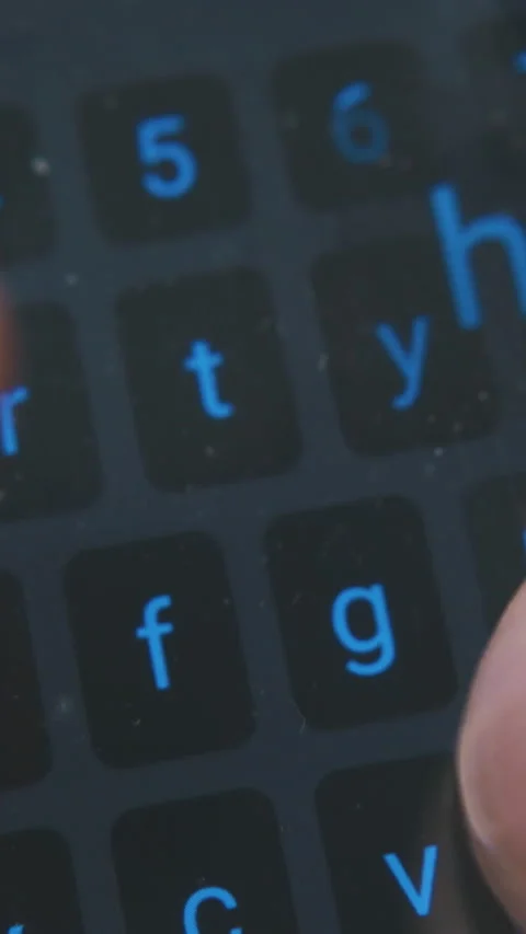 Man tapes text on touch pad keyboard extreme close view Stock Footage 317388877