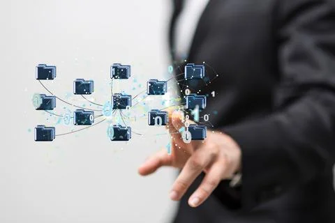 A man tapping on a 3D rendering of interconnected filing folders - Big digita Foto stock