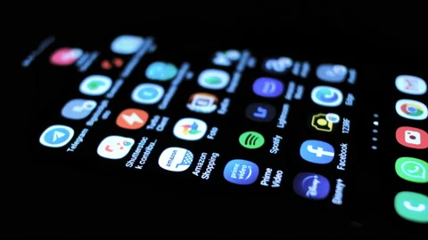Man tapping on amazon shopping app on a smartphone,new offers,ecommerce business Stock Footage 133537333