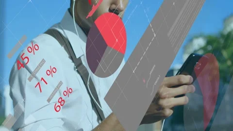 Man tapping cell screen and creating finance pie charts, map overlays obscuring Stock Footage 333477587