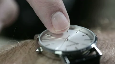 Man tapping his watch. He's late or he's waiting or simply checking. Stock Footage 55620639