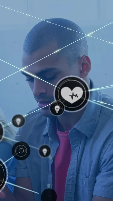 Man tapping laptop on couch, activating health heart over chest and node network 스톡 동영상 330306186