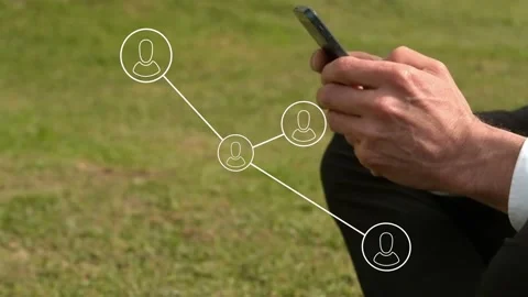 Man tapping phone and activating network morphing from circles to avatar nodes Stock Footage 334703075