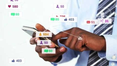 Man tapping phone and swiping, growing social badges around phone while boosting Stock Footage 331026768