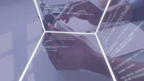 Man tapping phone and typing laptop at desk, activating holographic code cube Video stock 335466189