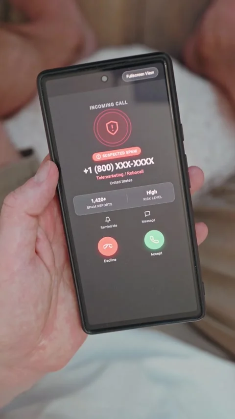 Man tapping screen to block and report a scam caller on a smartphone Vertical Stock Footage 341861144