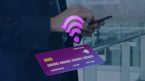 Man tapping smartphone, activating holographic card and pulsing Wi?Fi icon for Stock Footage 334466198