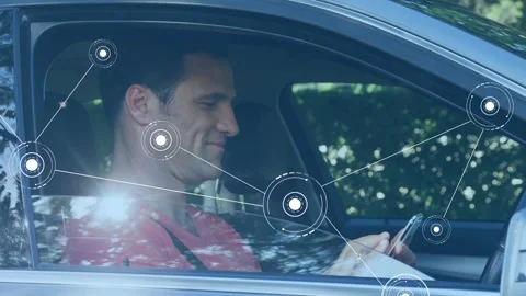 Man tapping smartphone and glancing down, generating network nodes filling car Stock Footage 333720385