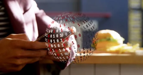 Man tapping smartphone at cafe counter, summoning binary globe wrapping phone Stock Footage 331109358