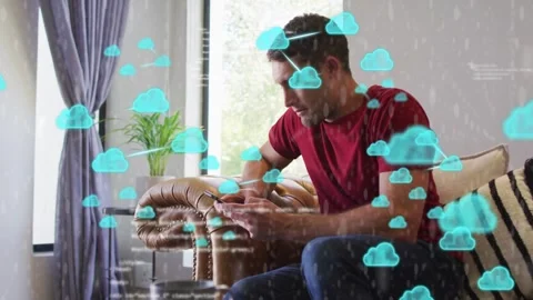 Man tapping smartphone causing blue cloud icons and code overlays growing Stock Footage 333734369
