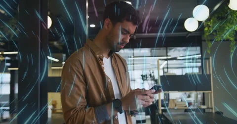Man tapping smartphone for data visualization causing swirling digital light Stock Footage 314532766