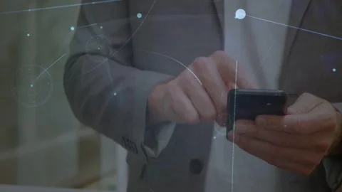 Man tapping smartphone, generating growing tech network lines, nodes, flare Stock Footage 332821760