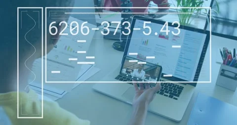 Man tapping smartphone starting code updating with glitch bars over laptop Stock Footage 317608123