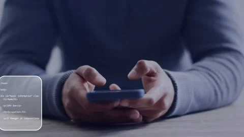 Man tapping smartphone at table, generating web code overlays shifting and Stock Footage 334743651