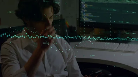 Man tapping smartphone then shifting to monitor, typing to review code while Stock Footage 327803339
