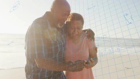 Man tapping smartphone while woman leaning in on shore, learning math as Video stock 333300911