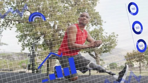 Man tapping smartwatch, stretching on mat in park, prosthetic blade and HUD Stock Footage 333602739
