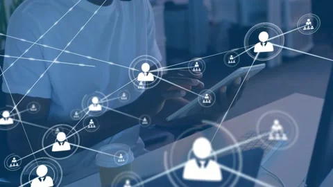 Man tapping tablet and phone at desk, technology network growing from single Stock Footage 329910007