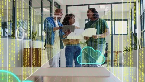 Man tapping tablet and woman lifting laptop causing cloud data overlay moving Stock Footage 329999931