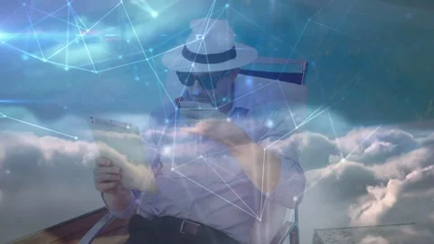 Man tapping tablet to check tech data, picking up round object while cloud Stock Footage 332544814