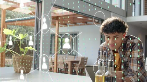 Man tapping tablet at counter holding mug generating animated user-network and Stock Footage 333873551