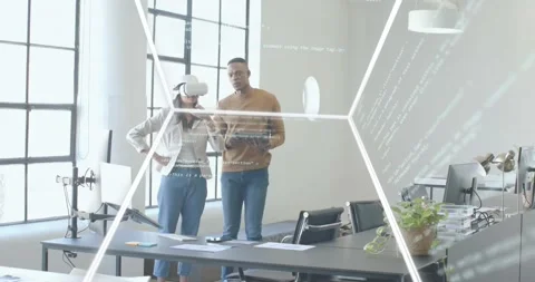 Man tapping tablet, creating rotating cube with code overlay while woman Stock Footage 320956494