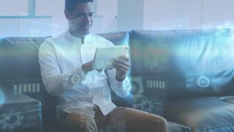 Man tapping tablet, initiating holo UI and revealing layered graphs, gears, code Stock Footage 334038024