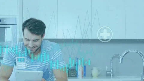 Man tapping tablet in kitchen activating waveform while icons appearing then Video stock 313569897