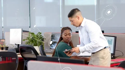 Man tapping tablet, receiving visual cue, walking to woman, comparing animated Stock Footage 333733783