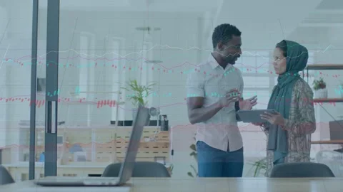 Man tapping tablet to show data, woman reviewing screen, charts appearing, Stock Footage 334703012