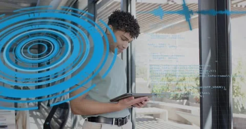 Man tapping tablet, starting blue ring and code overlay obscuring him while Stock Footage 322704396