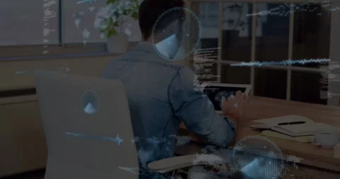 Man tapping tablet in tech office and activating animated waveforms, globe, code Stock Footage 331227444