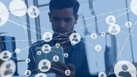 Man tapping tablet in technology office, generating network nodes overlay and Vídeos de archivo 330936141