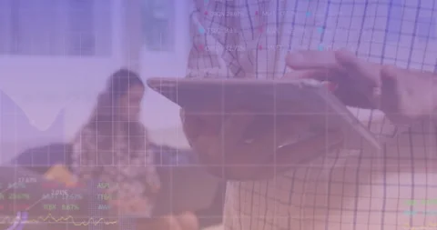 Man tapping tablet touchscreen and swiping tech data charts while analyzing 動画素材 311663879