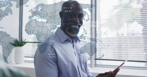 Man tapping tablet to unlock global data analytics while scrolling through map 動画素材 314410003