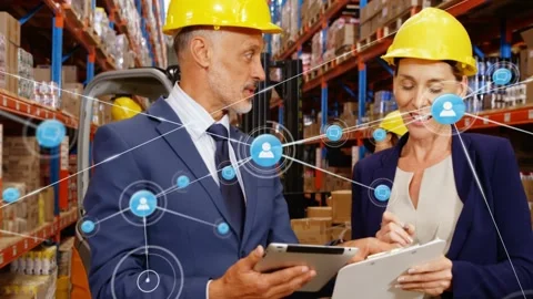 Man tapping tablet while woman taking notes in depot, graph nodes growing around Stock Footage 330191020