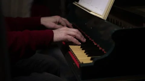 Man tapping time before playing a harpsichord solo Stock Footage 152142825
