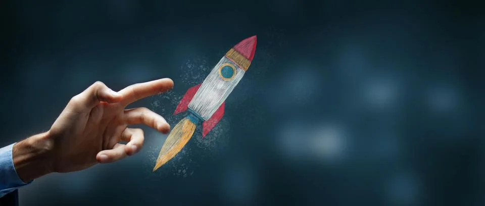 Man taps on screen rocket icon on dark background. Stock Photos